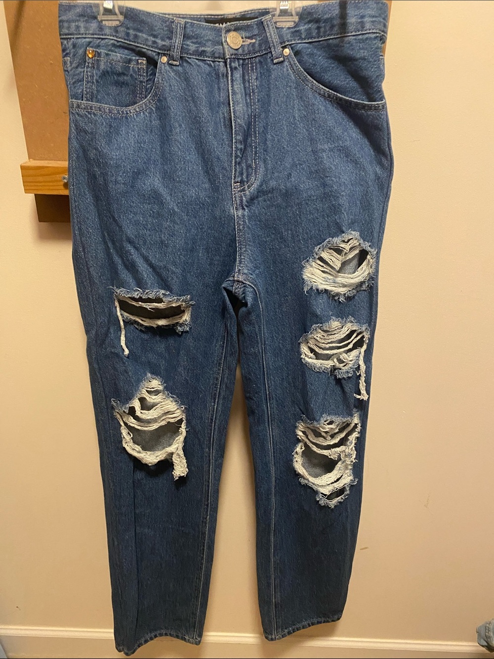 Woman’s High-Rise Distressed Blue Denim Jeans